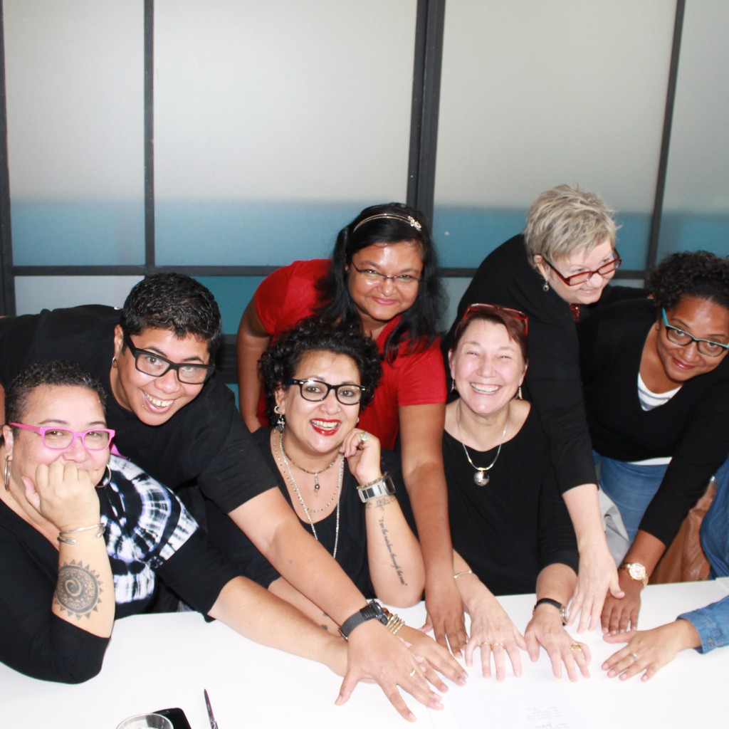 Members of the We Rise Coalition sign the Memorandum of Understanding. Photo: Meghan Cooper