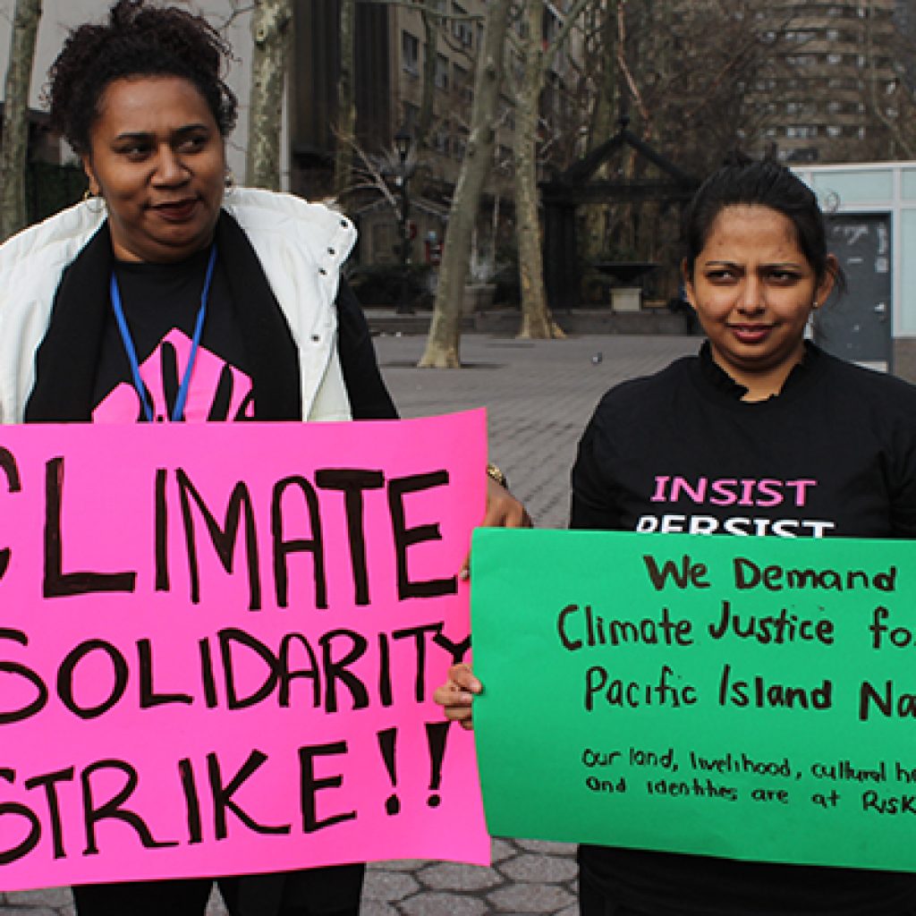 Members of the We Rise coalition march at a climate justice rally in New York City