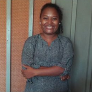 A woman from the family support centre in the Solomon Islands smiles
