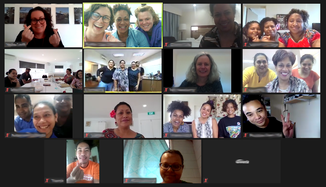 A picture of a zoom call with smiling faces on screen